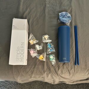 Blue simple modern 28 oz tumbler with straw and flip lid.